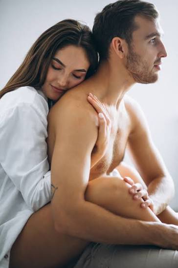Confident mature man smiling with his partner in a modern home, representing men's wellness, vitality, confidence, and active lifestyle support associated with TiTAN V Male Enhancement Canada.